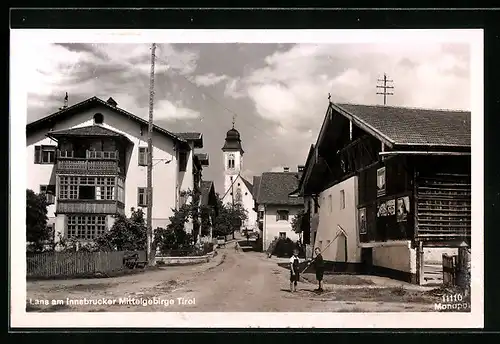 AK Lans, Strassenpartie mit Kirche