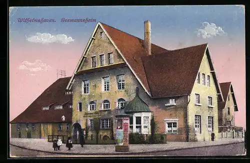 AK Wilhelmshaven, Strassenpartie mit Seemannsheim und Litfasssäule