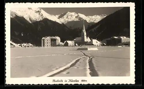 AK Mallnitz, Ortspartie mit Kirche im Schnee