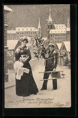 AK Weihnachtsgrüsse, Frau mit Geschenken, Page trägt Weihnachtsbaum