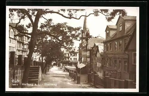 AK Marburg /Lahn, Partie im Steinweg mit Kirche