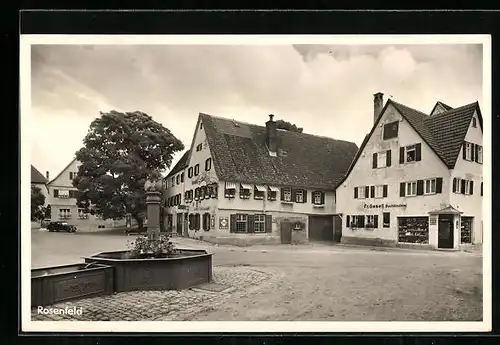 AK Rosenfeld, Strassenpartie mit Buchbinderei Fr. Gesell und Brunnen