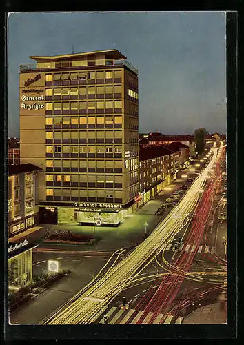 AK Reutlingen, Karlstrasse mit Hochhaus am Abend