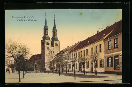 AK Schoenebeck a. Elbe, Strasse Breiteweg mit Geschäft und Kirche