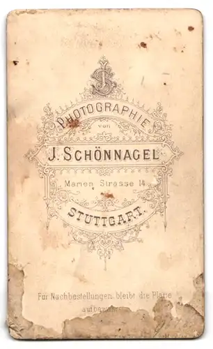 Fotografie J. Schnönnagel, Stuttgart, junge Frau im dunklen Kleid mit Bibel und Kruzifix Kette