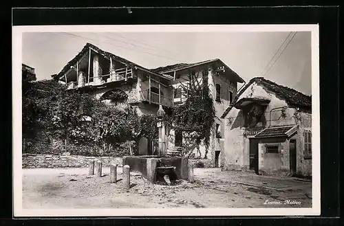 AK Losone, Ortsansicht mit Brunnen