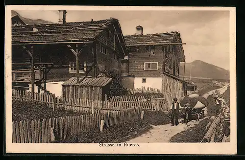 AK Rueras, Strasse mit Holzhäusern, Bauer mit Ochsenwagen