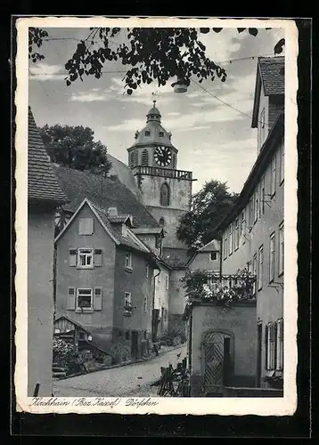 AK Kirchhain /Bez. Kassel, Strassenpartie im Dörfchen mit Kirchturm