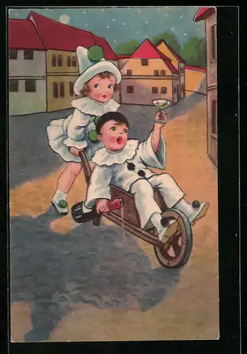 AK Kinder im Kostüm eines Harlekin, Mädchen fährt Jungen auf der Karre
