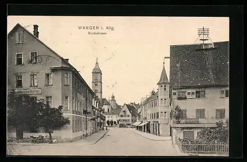 AK Wangen /Allg., Bindestrasse mit Kirche und Gasthaus zum goldenen Kreuz