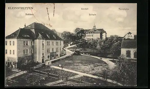 AK Kleinstruppen, Ansicht mit Schloss, Anstalt, Schule und Turnhalle