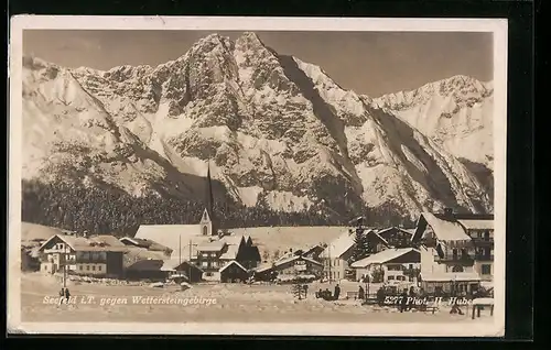 AK Seefeld i. T., Ortsansicht im Winter gegen Wettersteingebirge