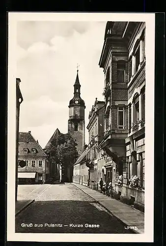 AK Pulsnitz, Blick auf die Kurze Gasse mit Turm