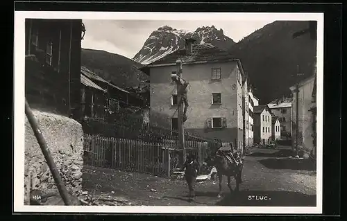 AK St. Luc, Mann mit Esel vor Flurkreuz