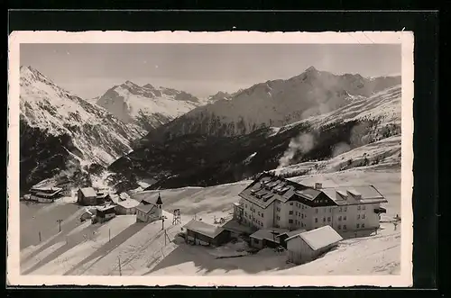 AK Hochsölden /Ötztal, Dorfansicht mit Kirche im Schnee