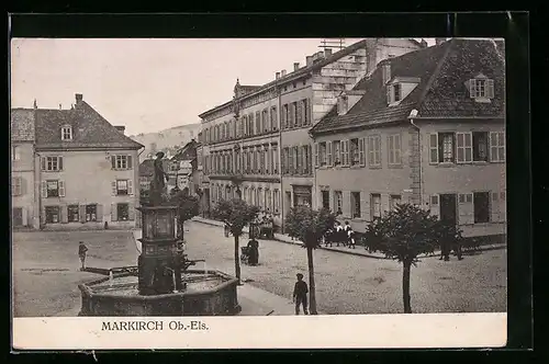 AK Markirch /Ob.-Els., Strassenpartie mit Brunnen