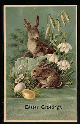 AK Osterhasen mit bunten Eiern sitzen auf einer Frühlingswiese