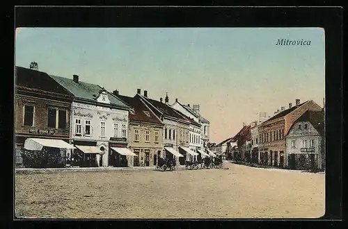 AK Mitrovica, Strassenpartie mit Kutschen