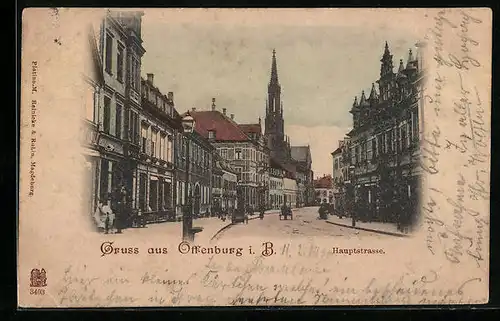 AK Offenburg i. B., Hauptstrasse mit Geschäften und Kirche