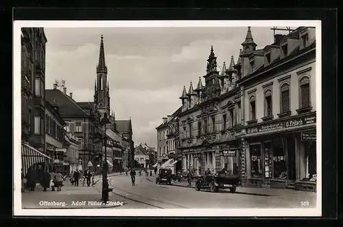 AK Offenburg, Strasse mit Kirche und Geschäften