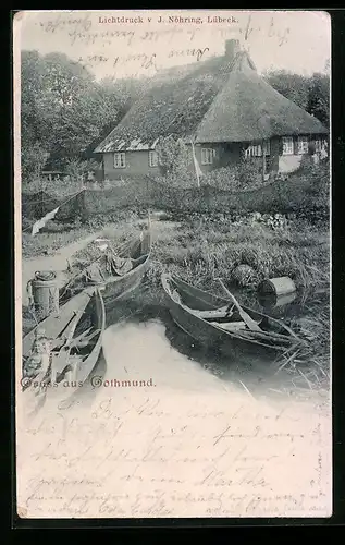 AK Gothmund, Ruderboote vor einem Reetdachhaus