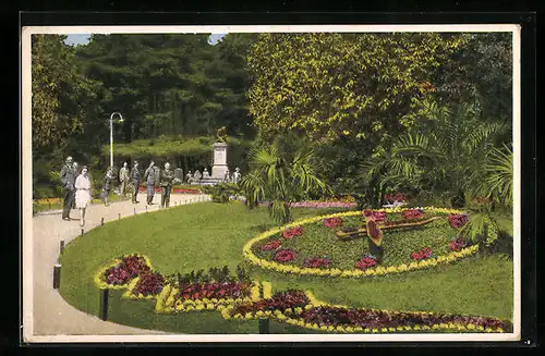 AK Komotau, Blumen-Uhr und Kriegerdenkmal