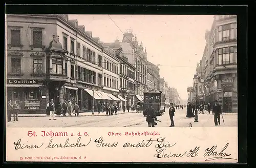 AK St. Johann a. d. S., Obere Bahnhofstrasse mit Strassenbahn