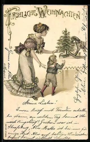Präge-AK Frau mit einem Jungen am Gabentisch, Schaukelpferd, Weihnachtsgruss