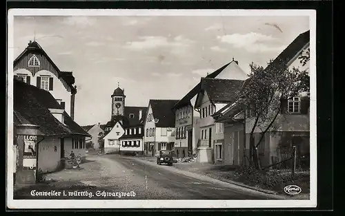 AK Conweiler i. württbg. Schwarzwald, Strassenpartie mit Litfasssäule