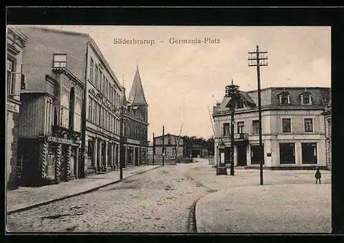 AK Süderbrarup, Germania-Platz mit Strasse und Kirche, mit Geschäft Carl Schepler