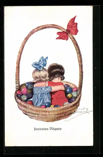 Künstler-AK Chicky Spark: Mädchen sitzen in einem Korb voller Ostereier, Joyeuses Paques!