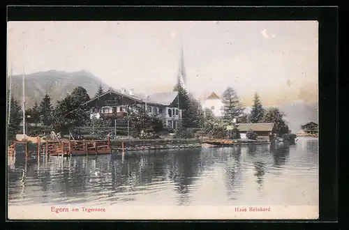 AK Egern /Tegernsee, Haus Reinhard mit Kirche, vom Wasser gesehen