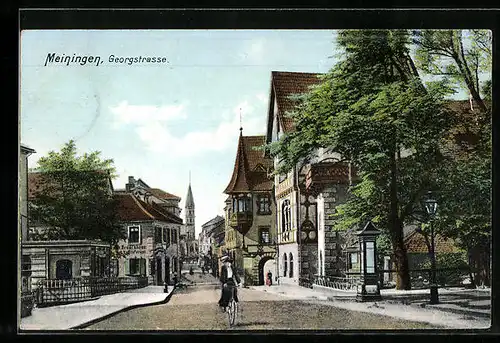 AK Meiningen, Georgstrasse mit Radfahrerin