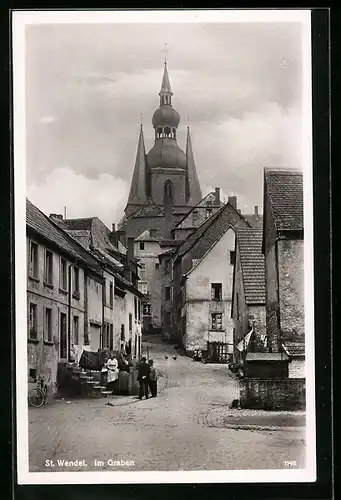AK St. Wendel, Strassenpartie im Graben, Blick zur Kirche