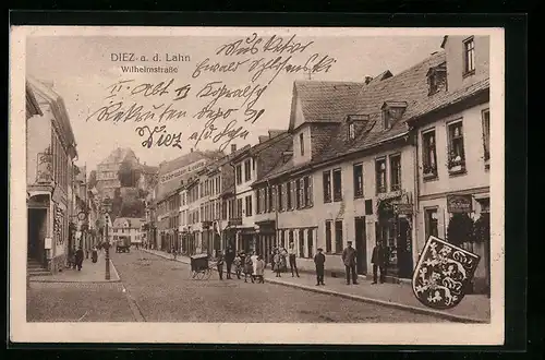 AK Diez a. d. Lahn, Wilhelmstrasse mit Geschäften, Wappen