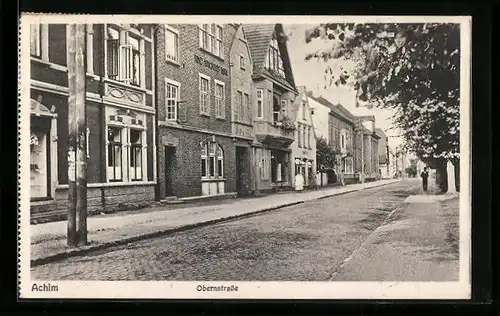 AK Achim, Obernstrasse mit Geschäften und Passant