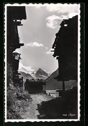 AK Ayer, Blick durch die Häuser auf die Berge