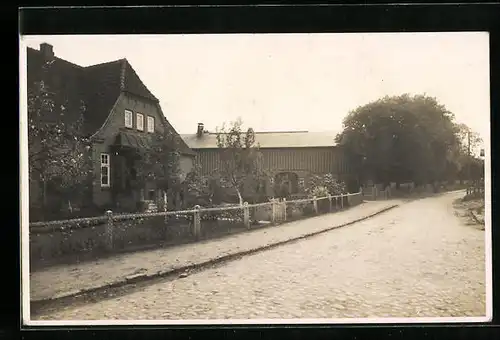 AK Lütjenwestedt, Strassenpartie mit einem Wohnhaus