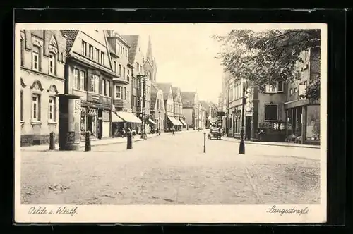 AK Oelde i. W., Langestrasse mit Litfasssäule und Kirche