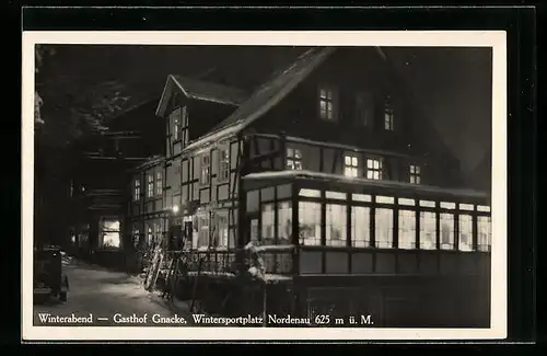 AK Nordenau, Gasthof Gnacke an einem Winterabend