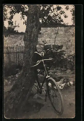 AK Bub in Matrosendress auf einem Fahrrad