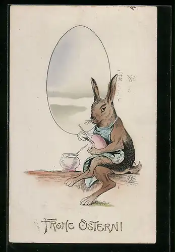AK Osterhase bemalt ein Osterei