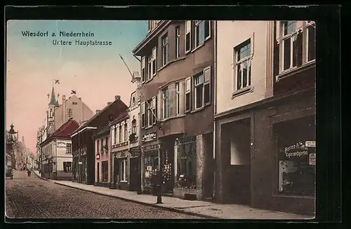 AK Wiesdorf a. Niederrhein, Untere Haupstrasse mit Geschäften