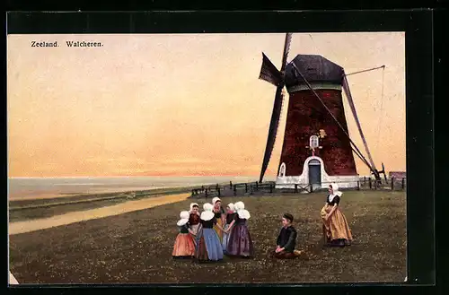 Künstler-AK Photochromie Nr. 2934: Zeeland, Walcheren, Kinder in Tracht spielen vor einer Windmühle