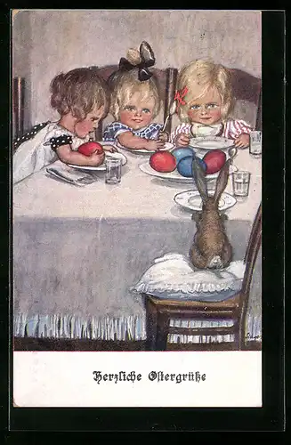AK Osterhase sitzt am Tisch mit Kindern