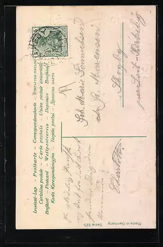 AK Osterhase bemalt ein Osterei