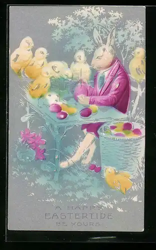 Präge-AK Osterhase bemalt ein Osterei