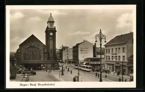 AK Hagen /Westf., Hauptbahnhof mit Geschäften und Strassenbahn