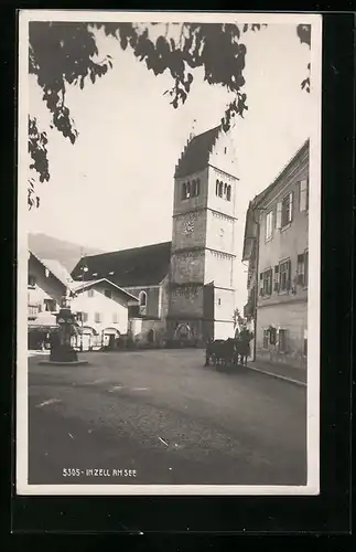 AK Zell am See, Strassenpartie mit Pferdewagen, Uhrenturm