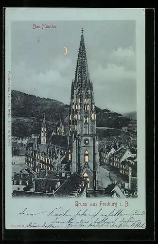 AK Freiburg i. B., Das Münster, Halt gegen das Licht: beleuchtete Fenster